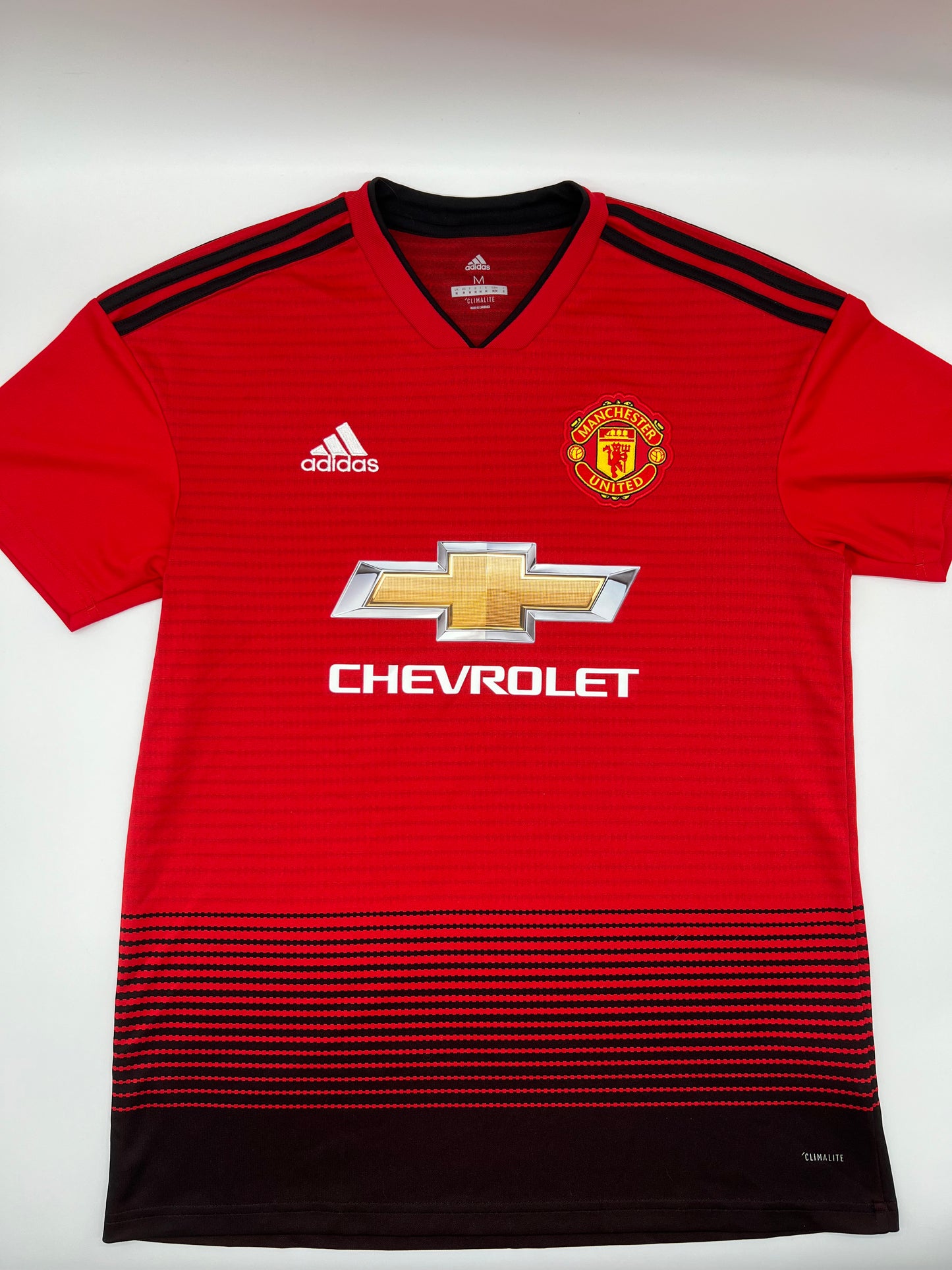 Ensemble maillot/short/chaussettes Manchester United rouge/noir